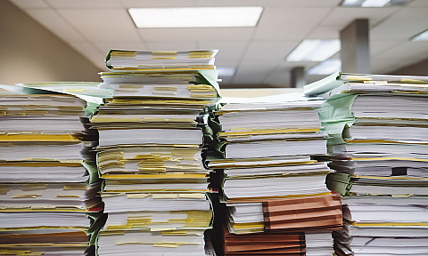 Stacks of Folders and Papers